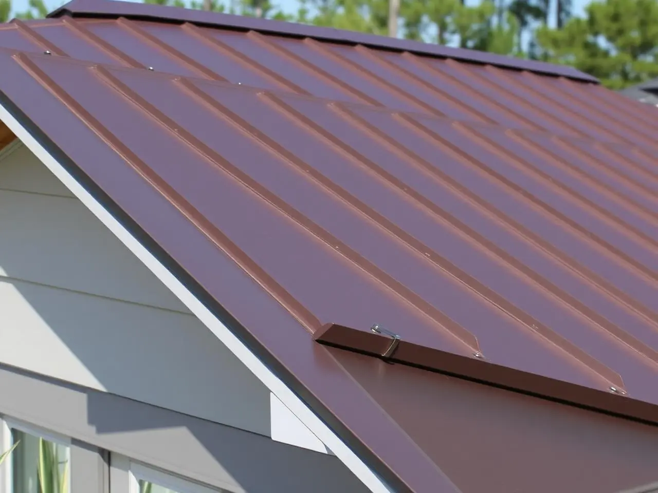 New dark bronze standing seam metal roof with concealed fasteners